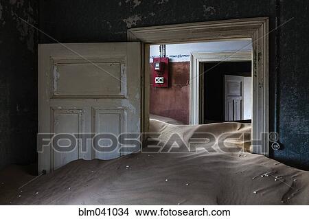 Picture - Sand piled in abandoned building. Fotosearch