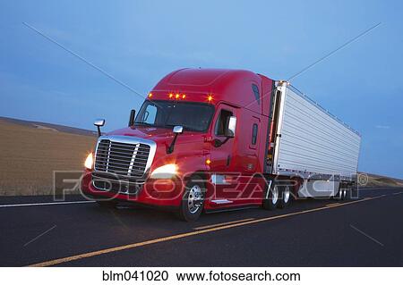 Truck driving on remote road View Large Photo Image Stock Image - Truck driving on remote road. Fotosearch