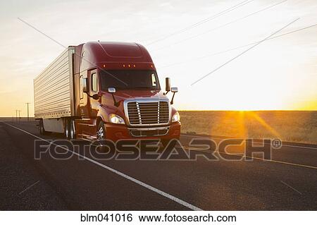 Truck driving on remote road View Large Photo Image Stock Photograph - Truck driving on remote road. Fotosearch