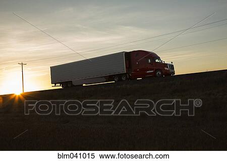 Truck driving on remote road View Large Photo Image Stock Photography - Truck driving on remote road. Fotosearch