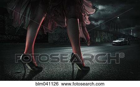 Woman wearing high heels on street at night View Large Photo Image Stock Photograph - Woman wearing high heels on street at night. Fotosearch