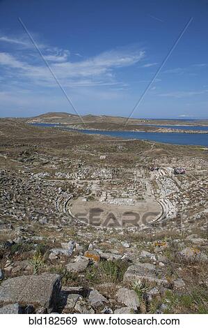 Aerial view of amphitheater ruins, Delos, Cyclades, Greece View Large Photo Image Stock Photo - Aerial view of amphitheater ruins, Delos, Cyclades, Greece. Fotosearch