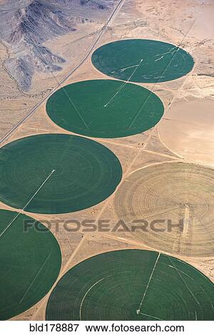 Aerial view of farm land in rural landscape View Large Photo Image Stock Photo - Aerial view of farm land in rural landscape. Fotosearch
