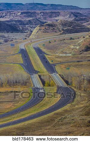 Stock Image - Aerial view of freeway in rural landscape. Fotosearch