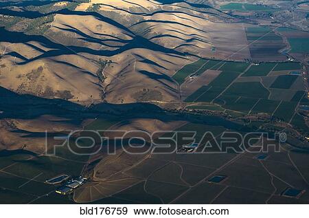 Aerial view of hills in rural landscape View Large Photo Image Stock Photo - Aerial view of hills in rural landscape. Fotosearch
