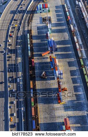 Stock Image - Aerial view of shipping yard and freeway. Fotosearch