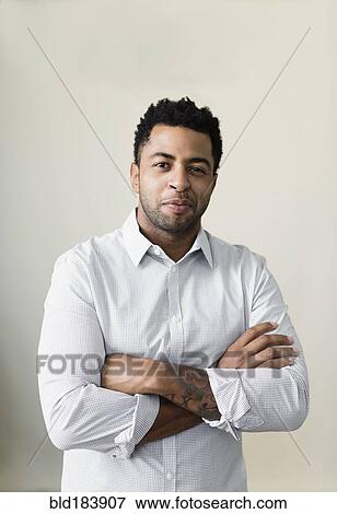 African American businessman smiling with arms crossed View Large Photo Image Stock Photo - African American businessman smiling with arms crossed. Fotosearch