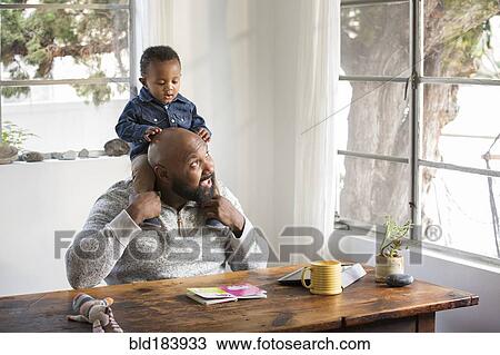 African American father holding baby son on shoulders View Large Photo Image Stock Image - African American father holding baby son on shoulders. Fotosearch