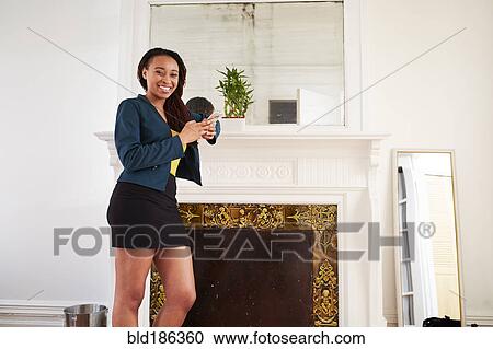 African American woman smiling near fireplace View Large Photo Image Stock Image - African American woman smiling near fireplace. Fotosearch