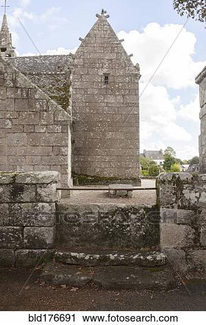 Stock Image - Ancient stone church and courtyard. Fotosearch