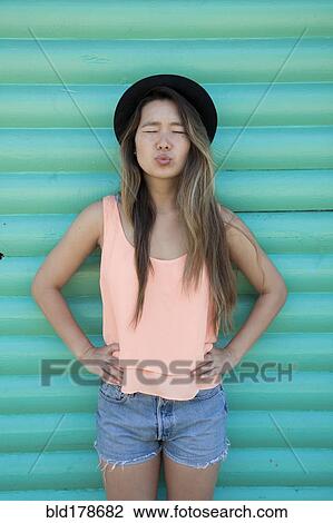 Asian woman blowing a kiss View Large Photo Image Stock Image - Asian woman blowing a kiss. Fotosearch