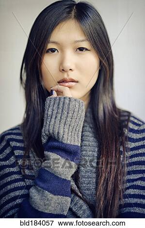 Stock Photo - Asian woman with serious expression. Fotosearch