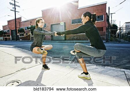 Athletes balancing on sidewalk View Large Photo Image Picture - Athletes balancing on sidewalk. Fotosearch