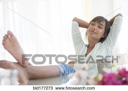 Barefoot mixed race woman relaxing View Large Photo Image Stock Image - Barefoot mixed race woman relaxing. Fotosearch