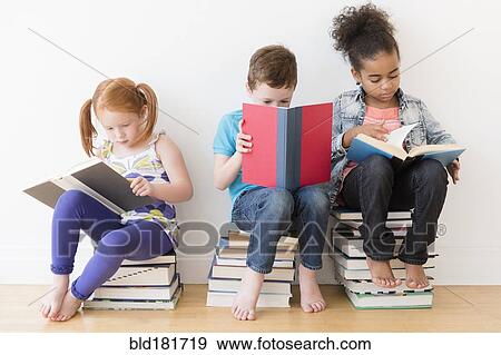 Stock Photo - Barefoot students reading books. Fotosearch