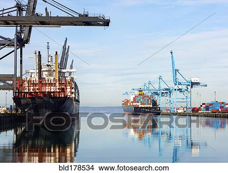 Barges with containers in industrial shipyard View Large Photo Image Picture - Barges with containers in industrial shipyard. Fotosearch