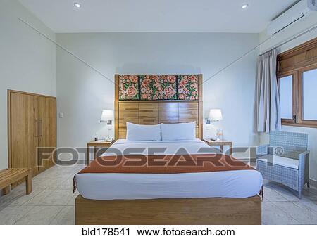 Bed and night table in modern bedroom View Large Photo Image Stock Image - Bed and night table in modern bedroom. Fotosearch