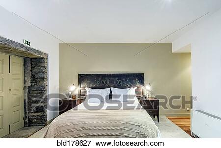 Bed and night tables in hotel room View Large Photo Image Stock Photo - Bed and night tables in hotel room. Fotosearch