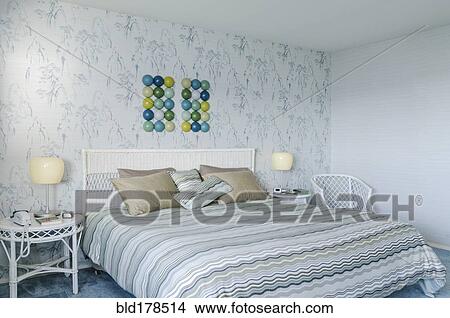 Picture - Bed and wall art in modern bedroom. Fotosearch