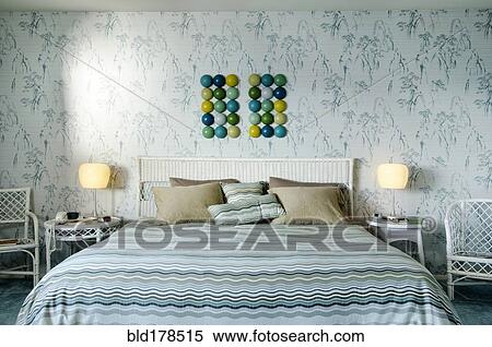 Bed and wall art in modern bedroom View Large Photo Image Stock Photography - Bed and wall art in modern bedroom. Fotosearch