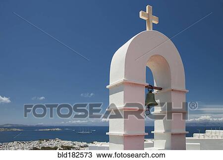 Bell arch and Mykonos cityscape under blue sky, Cyclades, Greece View Large Photo Image Stock Image - Bell arch and Mykonos cityscape under blue sky, Cyclades, Greece. Fotosearch