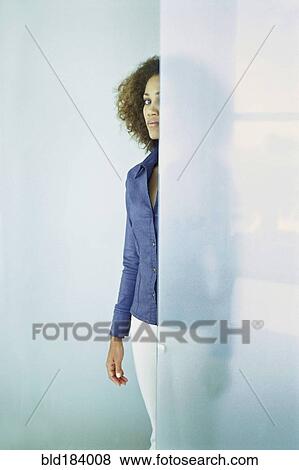 Black businesswoman standing behind glass wall View Large Photo Image Stock Photo - Black businesswoman standing behind glass wall. Fotosearch