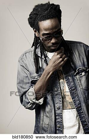 Stock Image - Black man looking down. Fotosearch