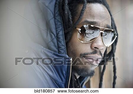 Stock Photo - Black man wearing sunglasses. Fotosearch
