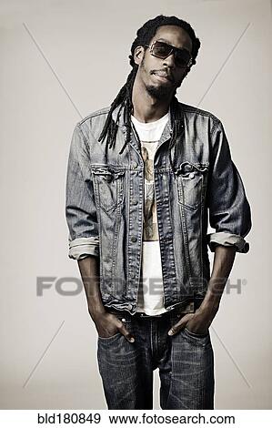 Stock Photo - Black man with hands in pockets. Fotosearch