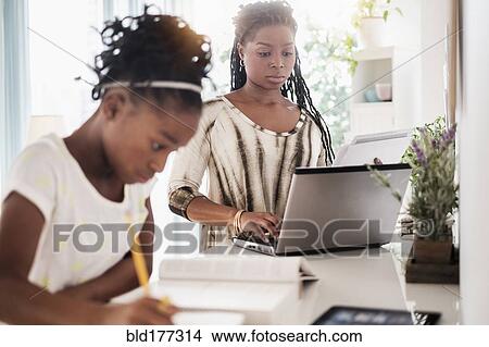 Black mother and daughter studying View Large Photo Image Picture - Black mother and daughter studying. Fotosearch