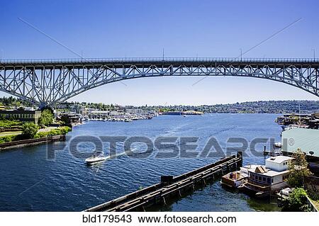 Blue sky and bridge over urban marina View Large Photo Image Stock Image - Blue sky and bridge over urban marina. Fotosearch