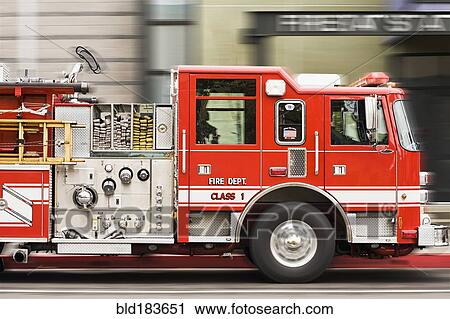 Blurred view of fire truck driving in city View Large Photo Image Stock Image - Blurred view of fire truck driving in city. Fotosearch