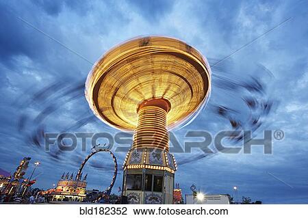 Blurred view of ride at amusement park View Large Photo Image Stock Image - Blurred view of ride at amusement park. Fotosearch