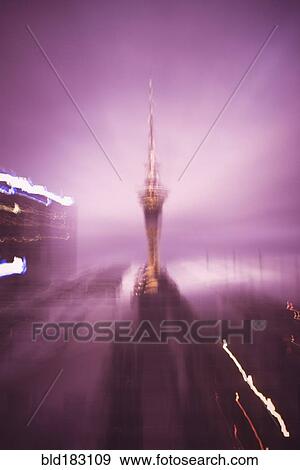 Stock Photo - Blurred view of Sky Tower in Auckland cityscape, Auckland, New Zealand. Fotosearch