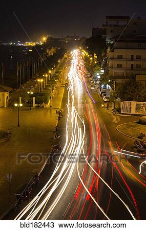 Stock Image - Blurred view of traffic on city street. Fotosearch