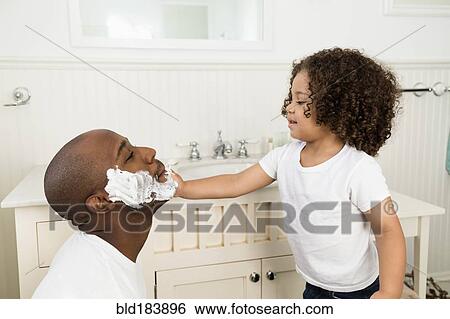 Boy helping father shave in bathroom View Large Photo Image Stock Photograph - Boy helping father shave in bathroom. Fotosearch