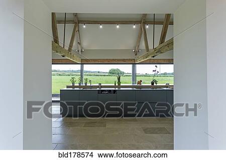 Picture - Breakfast bar and glass wall in modern kitchen. Fotosearch