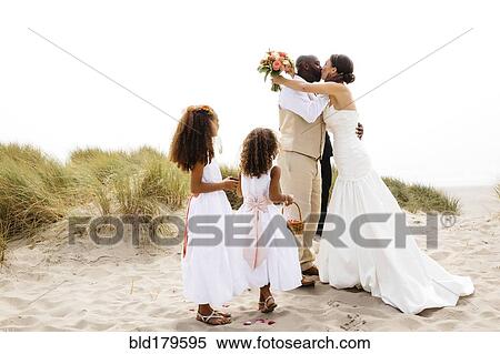 Bride and groom kissing in outdoor wedding View Large Photo Image Stock Photography - Bride and groom kissing in outdoor wedding. Fotosearch