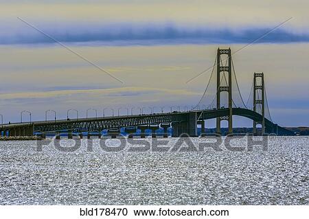Stock Image - Bridge over rippling water. Fotosearch