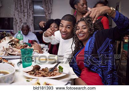 Brother and sister posing at dinner table View Large Photo Image Stock Image - Brother and sister posing at dinner table. Fotosearch
