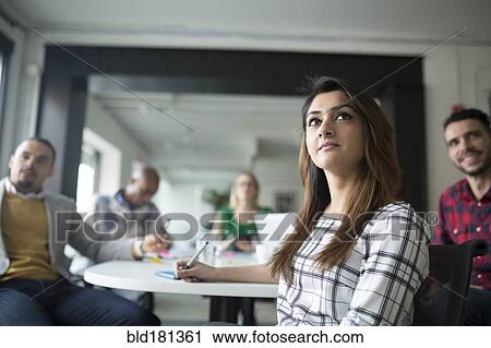 Business people listening in office meeting View Large Photo Image Stock Image - Business people listening in office meeting. Fotosearch