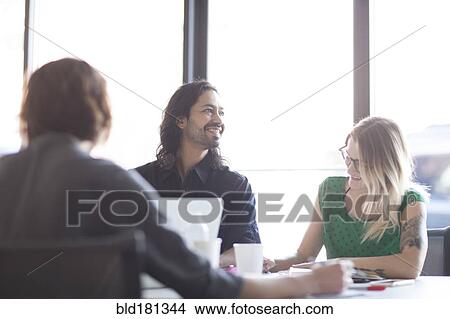 Business people talking in office meeting View Large Photo Image Picture - Business people talking in office meeting. Fotosearch