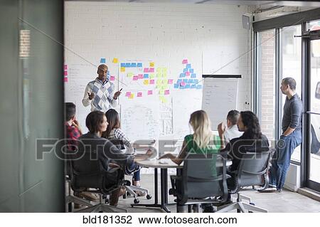 Business people talking in office meeting View Large Photo Image Stock Image - Business people talking in office meeting. Fotosearch