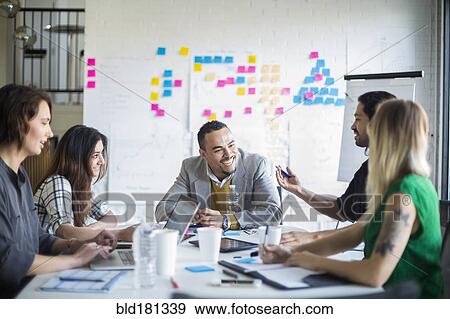 Business people talking in office meeting View Large Photo Image Stock Photo - Business people talking in office meeting. Fotosearch
