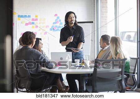 Business people talking in office meeting View Large Photo Image Stock Photo - Business people talking in office meeting. Fotosearch