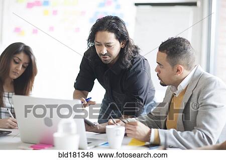 Business people talking in office meeting View Large Photo Image Stock Photo - Business people talking in office meeting. Fotosearch