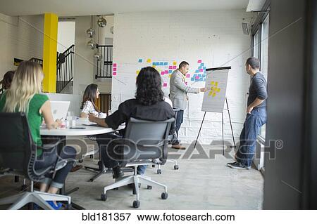 Business people talking in office meeting View Large Photo Image Stock Photo - Business people talking in office meeting. Fotosearch