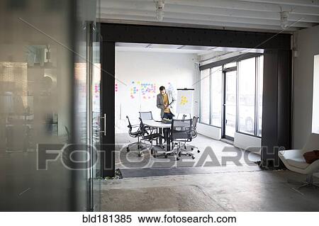 Stock Photography - Businessman working in office. Fotosearch