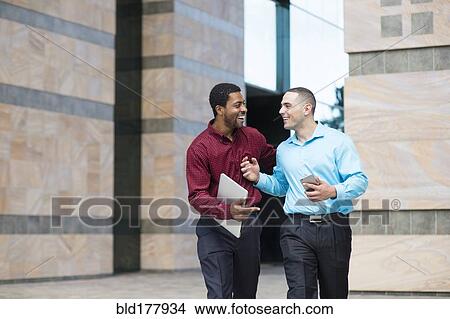 Businessmen talking outdoors View Large Photo Image Picture - Businessmen talking outdoors. Fotosearch