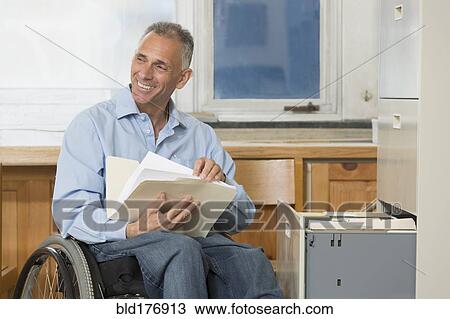 Stock Image - Caucasian architect working in office. Fotosearch